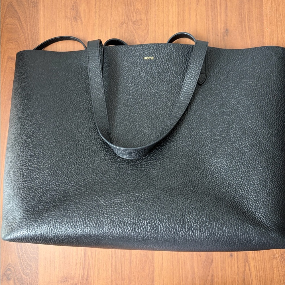 Cuyana large black leather tote inscribed with “Hopie”gold letters